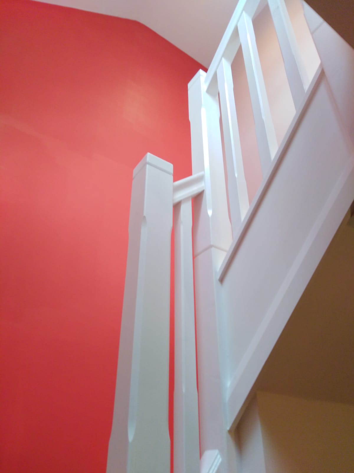 White banisters & coral wall